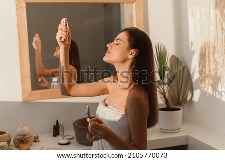 Similar – Image, Stock Photo Relaxed woman applies mineral clay mask on face for rejuvenation, has headband on head