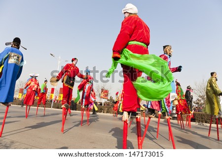 YU COUNTY CHINA FEBRUARY 5: People performing folk stilt-walking for celebrating Lantern Festival on February 5 2012 in Yu County, China.