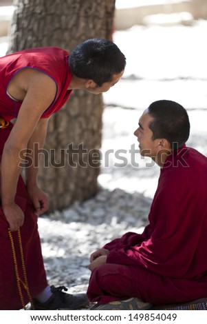 LHASA, TIBET- OCT 07: Tibetan monks are debating over Buddhist Scriptures at the Sera Monastery on October 07, 2011 in Lhasa, Tibet