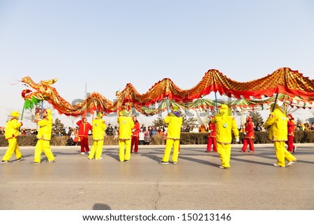 YU COUNTY CHINA FEBRUARY 5: People performing traditional dragon dance for celebrating Lantern Festival on February 5 2012 in Yu County, China.