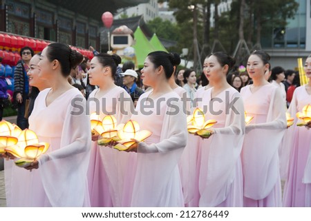 SEOUL KOREA MAY 12: People are performing folk dance for celebration of Lotus Lantern Festival on the street in front of Jogyesa Temple on may 12 2013, Seoul, Korea.