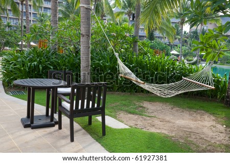Summer backyard with outdoor furnitures and hammock