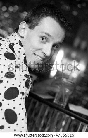 Smiling Man in Nightclub. Black and White