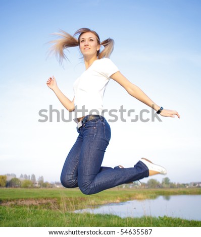 Woman jump in the Field