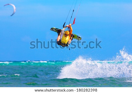 young kite surfer on tropical sea background Extreme Sport Kite surfing