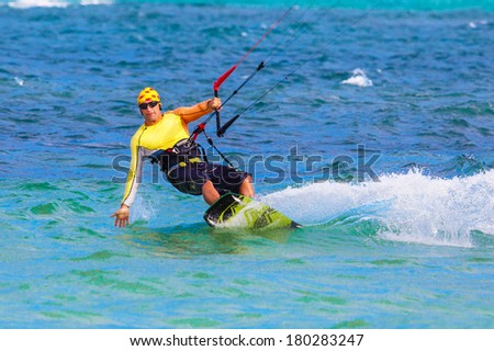 young smiling  kite surfer on tropical sea background Extreme Sport Kite surfing