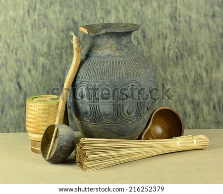 Antique pitcher and ancient kitchen utensils.