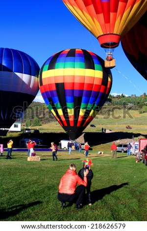 SNOWMASS, COLORADO - 09/14/2014: Mother and son watching hot air balloons at the Snowmass Balloon Festival
