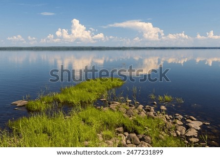 Similar – Foto Bild Felsenküste und friedliches Meer bei Sonnenuntergang