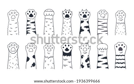 Cute cat paws. Doodle kitten and puppy limbs, wild or domestic animals furry feet with claws. Cartoon sketch of contour body parts. Black and white pets legs. Vector minimal background