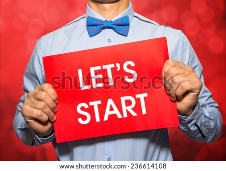 Businessman on red bokeh background with the text Let's party in a concept image