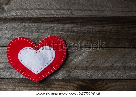 Vintage wooden background with hand made heart. Special love card for Valentine's Day