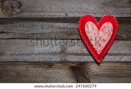 Vintage wooden background with hand made heart. Special love card for Valentine's Day