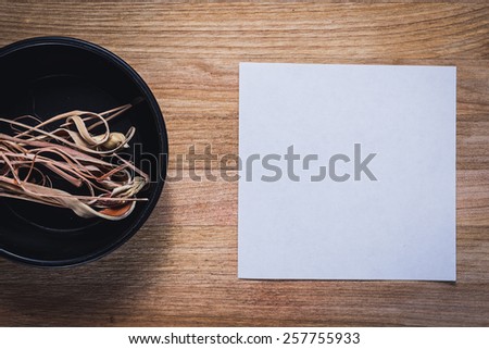 Spices for prepare tasty food with soft shadow in the wooden background with paper for text