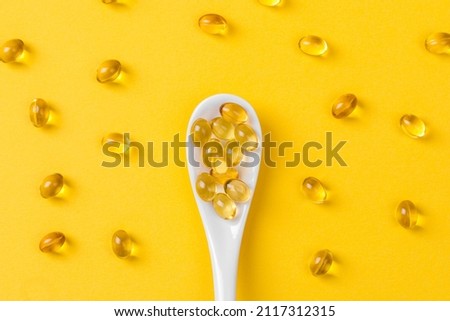 Close up of  oil filled capsules on spoon suitable for: fish oil, omega 3, omega 6, omega 9,  vitamin A, vitamin D, vitamin D3, vitamin E  Foto stock © 