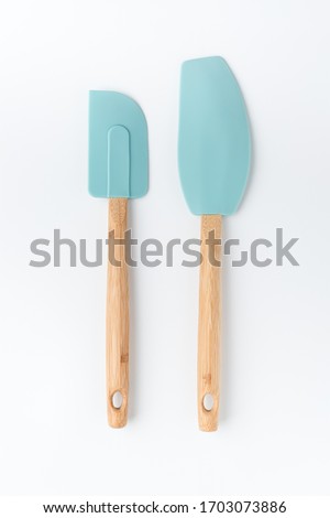 Silicone mixer and scraper spatula with bamboo handle on a white background Сток-фото © 
