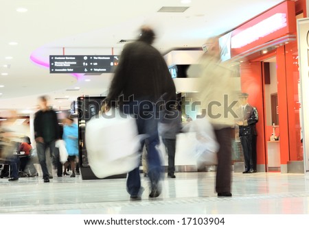 motion of busy shoppers in shopping mall