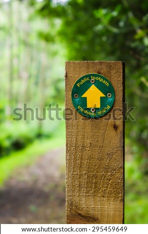 Footpath sign on a wooden post