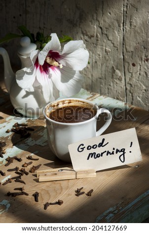 Pictures of sunny summer morning with beautiful flower, delicious turkish coffee on a rusted old table with decorations.