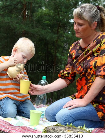mother and son relaxing - family picnic
