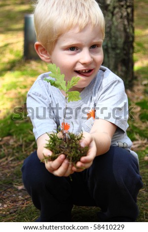 boy plants a tree