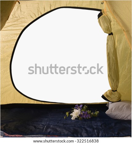 View from the tent, a sleeping bag in a tent cushion flowers