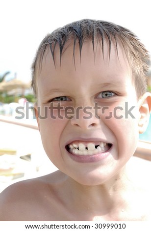 young child angry emotion portrait in the pool