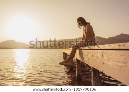 Similar – Image, Stock Photo Pensive woman sitting on bed