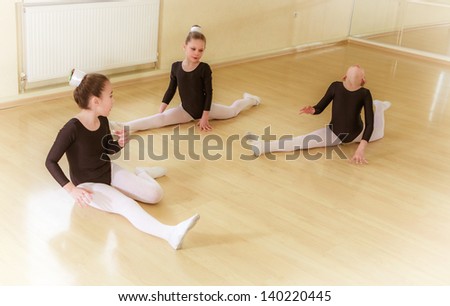 group of small dancers in a training hall