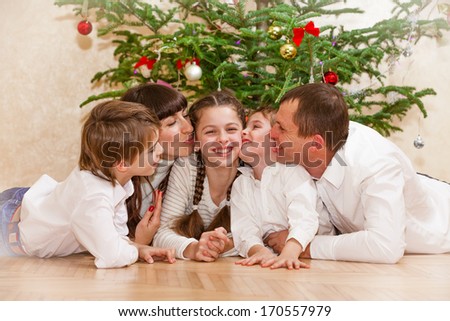 Portrait of friendly family on Christmas evening