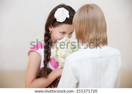 boy giving flowers to girl in Valentine\'s day