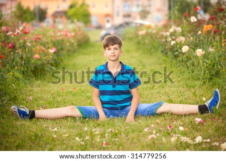 boy sits on a twine outdoor