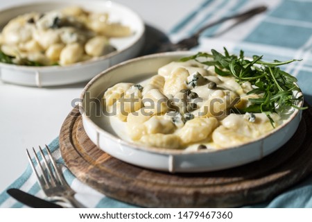 Similar – Image, Stock Photo Homemade gnocchi preparation on rustic kitchen table with ingredients. Top view. Potatoes dough . Italian food concept.