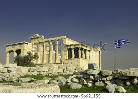 Erechtheum with Greek flag in Acropolis, Athens, Greece