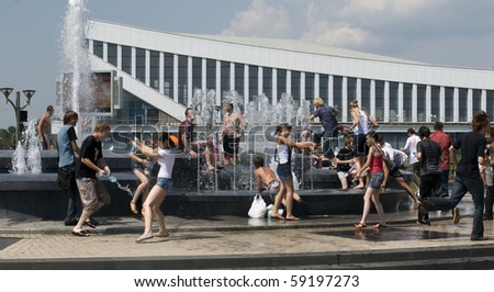 MINSK,BELARUS - JULY 18: Unidentified teenagers playing in fountain on July 18 in Minsk,Belarus . Due to extremely hot summer temperatures people are seeking alternative ways to cool themselves
