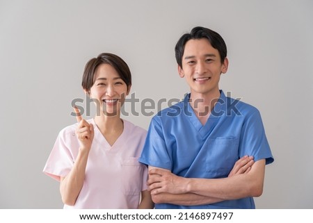Asian men and women in medical clothing Foto d'archivio © 