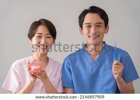 Asian men and women in medical clothing Foto stock © 