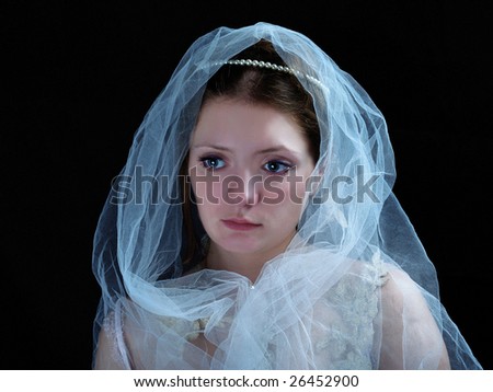 young beautiful bride in white veil on your head isolated on black