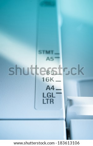 International Paper size marking and ruler on an office machine