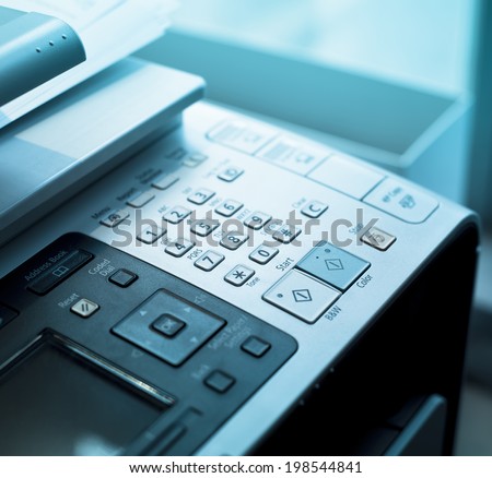 Dial Pad on a fax machine with blue lights