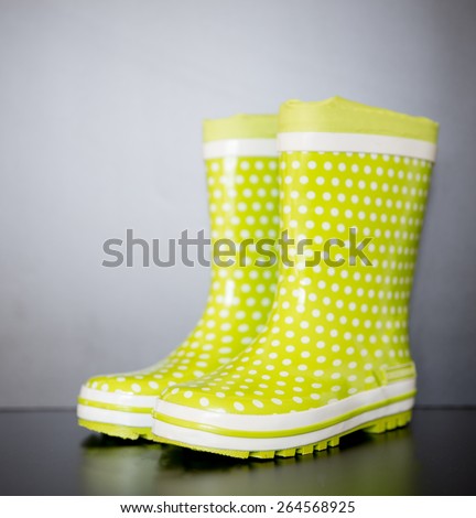 Green Wellington Boots with white dots.