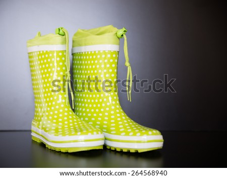 Green Wellington Boots with white dots.