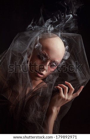 Model with a fake bald on black background