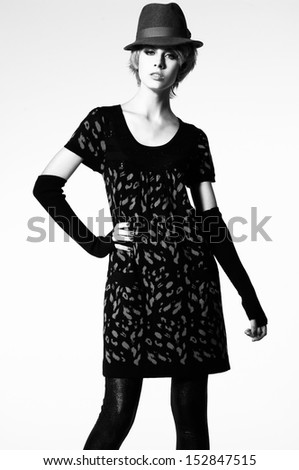 Retro Style. Fashion Portrait of a Beautiful Young Sexy Woman in Black Clothing