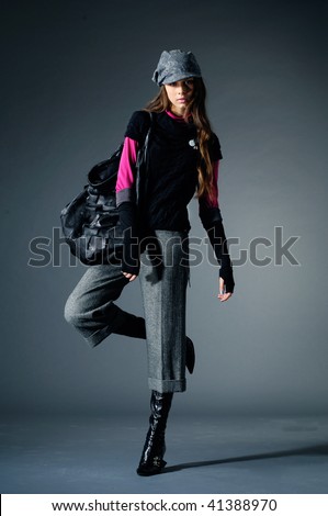 Young fashion model posing in the studio