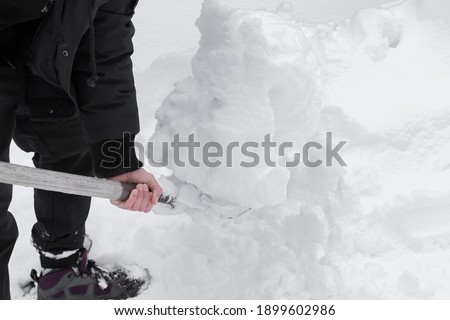 Similar – Foto Bild Mann räumt im Winter mit einer Schneefräse den Schnee beiseite