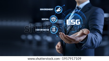 ESG environmental social governance business strategy investing concept. Businessman pressing button on screen.