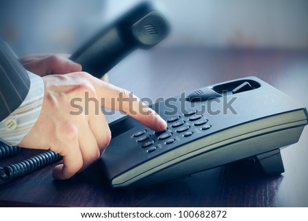 The businessman calling by phone.