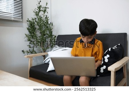 Similar – Image, Stock Photo Boy does homework