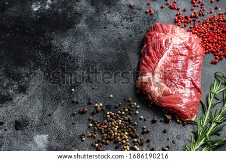 Flat iron steak, raw meat, marbled beef . Black background. Top view. Copy space ストックフォト © 